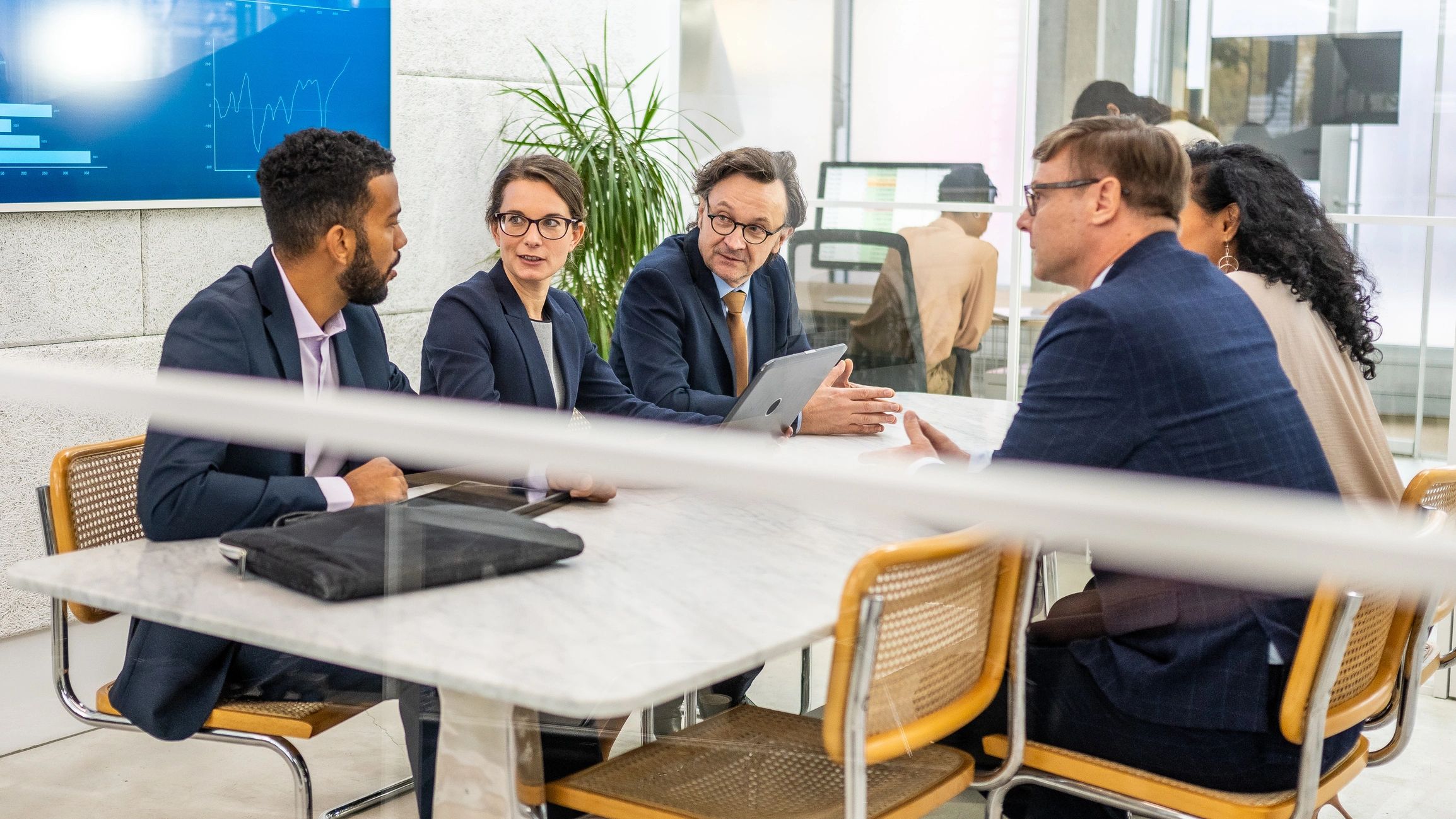 Business team discussing digital marketing strategy in a meeting