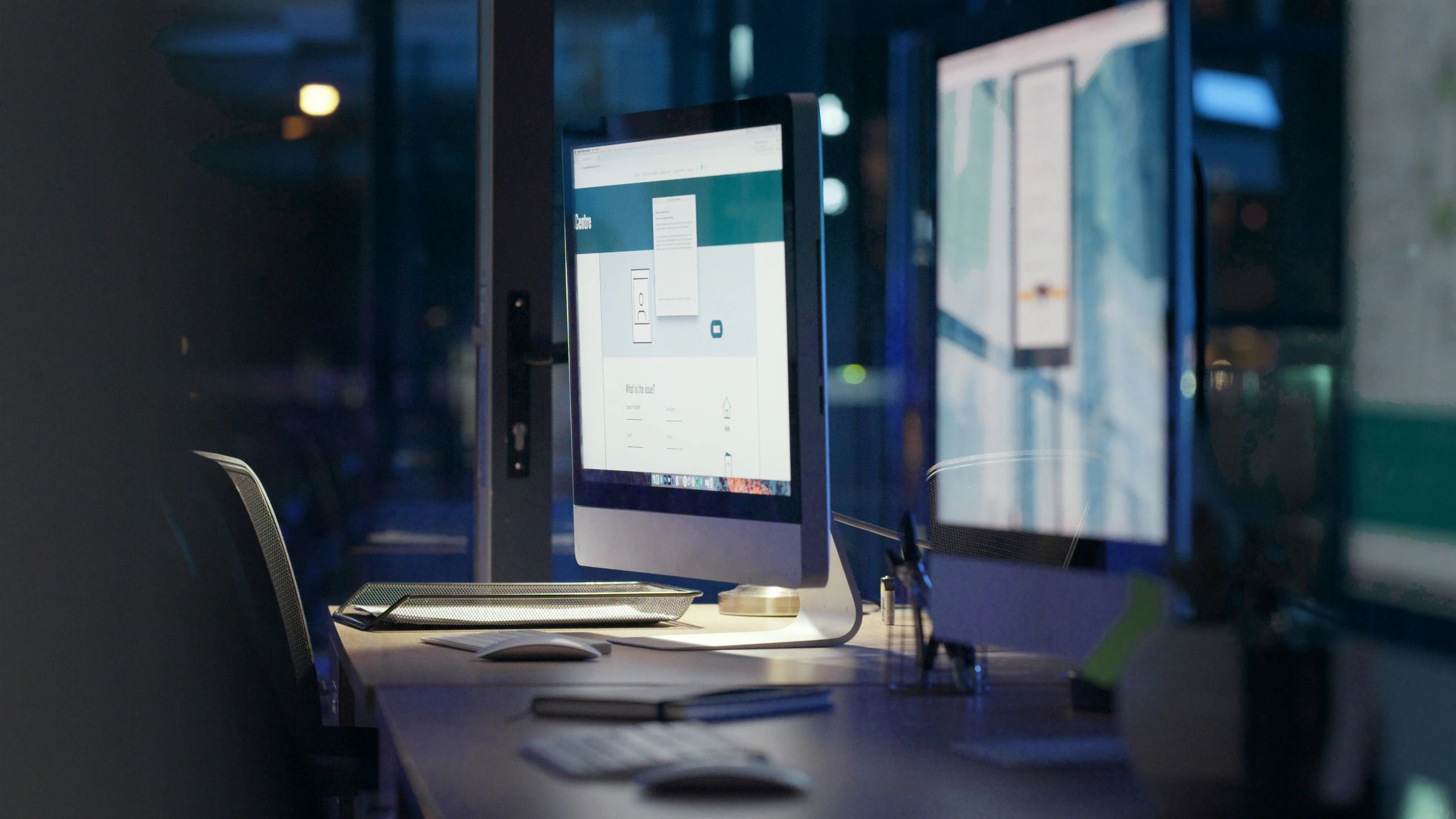 Web design workspace with desks and computer screens